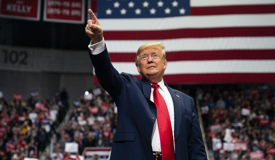 In this March 2, 2020, file photo President Donald Trump arrives to speak at a campaign rally at Bojangles Coliseum in Charlotte, N.C. The president and his allies are dusting off the playbook that helped defeat Hillary Clinton, reviving it in recent days as they try to frame 2020 as an election between a dishonest establishment politician and a political outsider being targeted for taking on the system. (AP Photo/Evan Vucci, File)