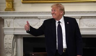 President Donald Trump gestures as he leaves a meeting with restaurant industry executives about the coronavirus response, in the State Dining Room of the White House, Monday, May 18, 2020, in Washington. (AP Photo/Evan Vucci)