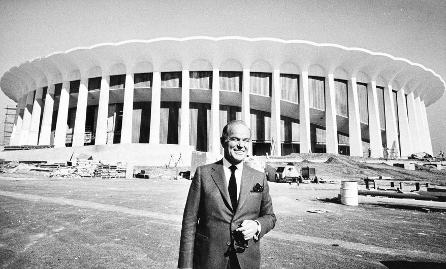 Multi-millionaire Jack Kent Cooke, poses outside The Forum in Inglewood, Calif., the sports palace he's building as the home base of his Los Angeles Lakers and Los Angeles Kings, Nov. 7, 1967. Dedication of the $16 million edifice is set for Dec. 30. (AP Photo/Harold Filan) **FILE**