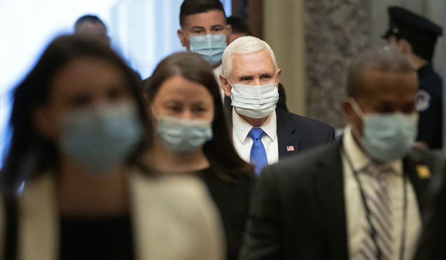 Vice President Mike Pence wears a face mask to protect against the spread of the new coronavirus as he arrives on Capitol Hill in Washington for a meeting with Senate Majority Leader Mitch McConnell of Ky., and Treasury Secretary Steve Mnuchin, Tuesday, May 19, 2020. (AP Photo/Patrick Semansky)
