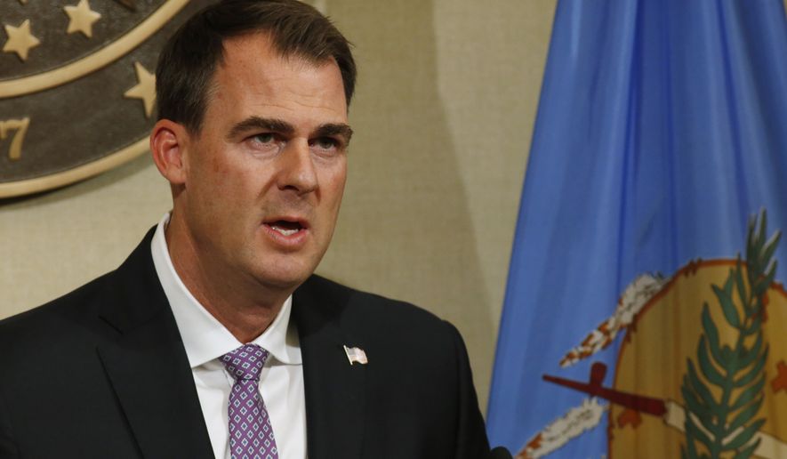 Oklahoma Gov. Kevin Stitt speaks during a news conference Wednesday, May 20, 2020, in Oklahoma City. Stitt said the state is launching an online portal for cities and counties to submit requests for reimbursement from federal funds for their coronavirus-related expenses. (AP Photo/Sue Ogrocki)