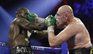  In this Feb. 22, 2020, file photo, Tyson Fury, of England, lands a right to Deontay Wilder, left, during a WBC heavyweight championship boxing match in Las Vegas. Boxing promoter Bob Arum says he plans to stage a card of five fights on June 9 at the MGM Grand. It&#x27;s the first of a series of fights over the next two months at the Las Vegas hotel. A second fight card will be held two nights later. ESPN will televise both cards to kick off twice weekly shows at the hotel in June and July. The fights are pending approval of the Nevada Athletic Commission. (AP Photo/Isaac Brekken, File)  **FILE**