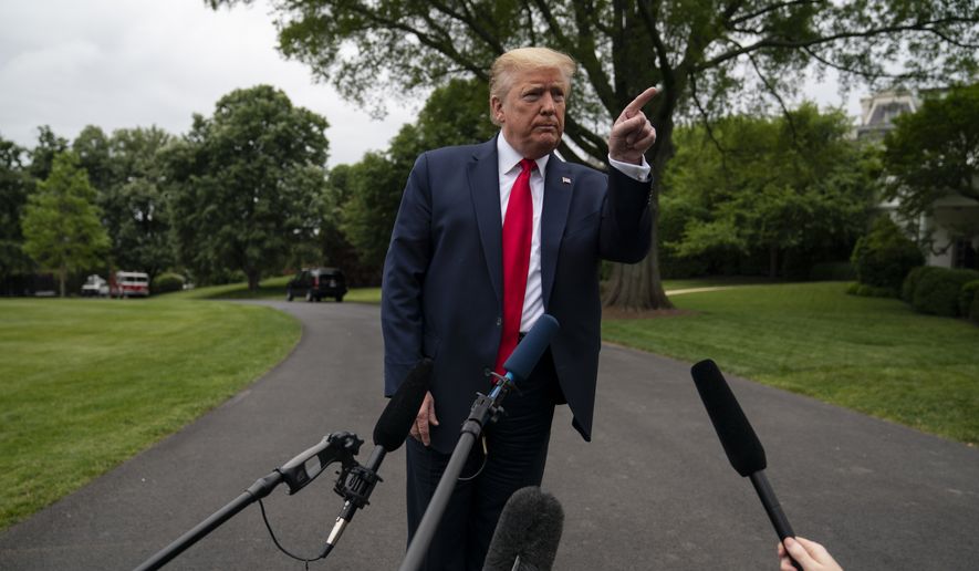 President Donald Trump talks to reporters before departing the White House for a trip to Michigan, Thursday, May 21, 2020, in Washington. (AP Photo/Evan Vucci)