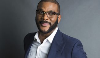 FILE - In this Nov. 16, 2017, file photo, actor-filmmaker and author Tyler Perry poses for a portrait in New York. Perry is looking to reopen his 330-acre Atlanta-based mega studio soon, but other studios in Georgia are anxiously waiting for Hollywood&#39;s green light to return back to work. Perry plans on restarting production at the Tyler Perry Studios complex in July, making it one of the first studios to domestically reopen after production was halted a few months ago to combat the spread of the coronavirus. (Photo by Amy Sussman/Invision/AP, File)