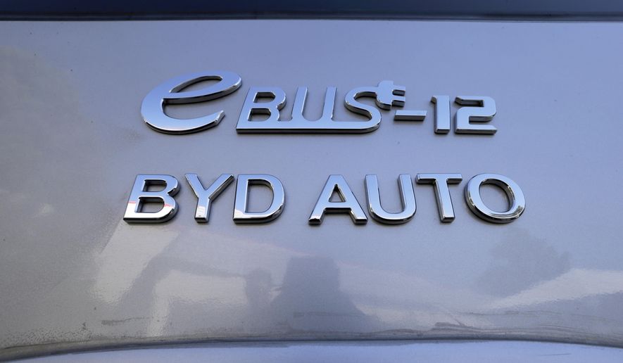 FILE - This May 1, 2013, file photo shows an electric bus manufacturing plant by the Chinese firm BYD, in the Southern California city of Lancaster. California Gov. Gavin Newsom took an extra $1.8 billion from the state's dwindling coffers to pay for more protective gear and extra hospital beds to aid the state's response to the coronavirus. More than $445 million of that amount will go to Chinese electric vehicle manufacturer BYD, which in April 2020, secured a $1 billion contract with the state to deliver 200 million masks a month. But BYD has had trouble fulfilling that contract. (AP Photo/Reed Saxon, File)