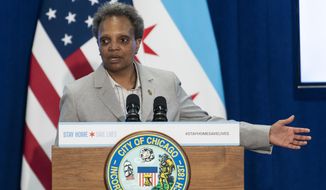 In this April 20, 2020, file photo, Chicago Mayor Lori Lightfoot speaks during a news conference in Chicago. Chicago officials say the nation&#39;s third-largest city cannot begin to loosen restrictions designed to limit the spread of the coronavirus before early June. Gov. J.B. Pritzker has said all parts of the state are on track for restrictions to begin loosening on May 29. But Mayor Lightfoot said Friday, May 22, that the city is not yet hitting the metrics in her plan for gradually loosening restrictions and that she is hopeful that can happen by early June. (Tyler LaRiviere/Chicago Sun-Times via AP, File)