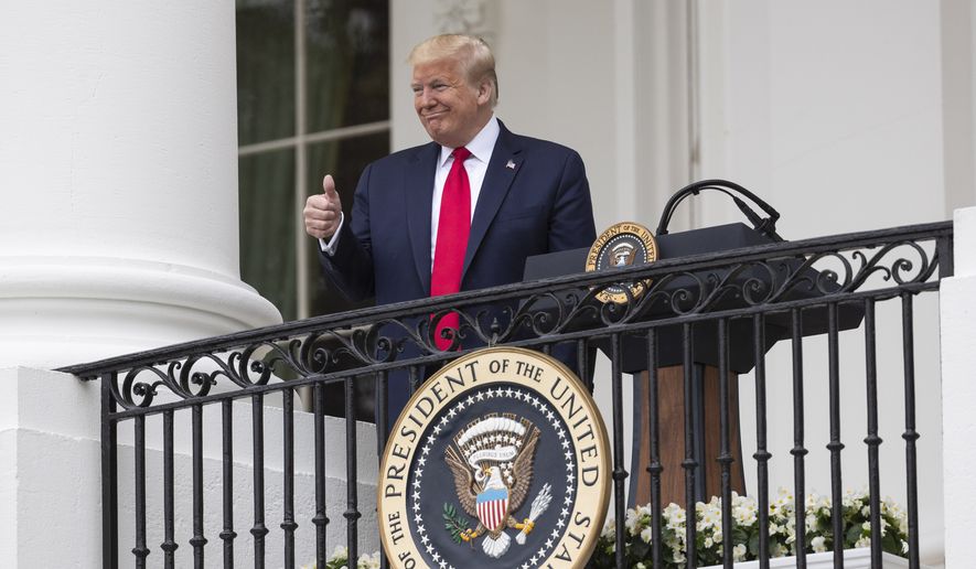 President Donald Trump gives thumbs up during a &quot;Rolling to Remember Ceremony,&quot; to honor the nation&#39;s veterans and POW/MIA, from the Blue Room Balcony of the White House, Friday, May 22, 2020, in Washington. (AP Photo/Alex Brandon)