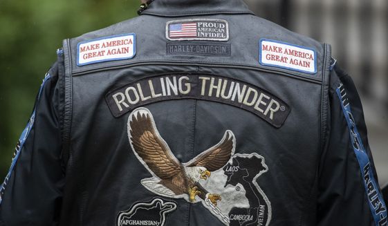 The back of Rolling Thunder jacket is seen before President Donald Trump speaks during a &quot;Rolling to Remember Ceremony,&quot; to honor the nation&#x27;s veterans and POW/MIA, from the Blue Room Balcony of the White House, Friday, May 22, 2020, in Washington. (AP Photo/Alex Brandon) ** FILE **