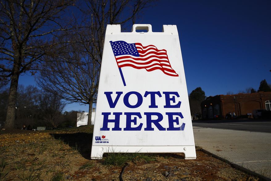 A vote here sign is seen outside a polling place during the South Carolina primary, Saturday, Feb. 29, 2020, in Columbia, S.C. (AP Photo/Matt Rourke)