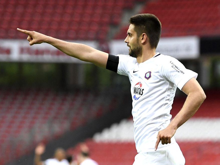Dimitrij Nazarov from Aue cheers about his goal during a match of German second Bundesliga disvison between 1. Fc Nuremberg and Ersgebirg Aue in Nuremberg,Germany, Friday, May 22, 2020. (Matthias Hangst/pool via AP)
