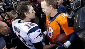 FILE - In this Jan. 24, 2016, file photo, New England Patriots quarterback Tom Brady, left, and Denver Broncos quarterback Peyton Manning speak to one another following the NFL football AFC championship game in Denver.  The next match involving Tiger Woods and Phil Mickelson involves a $10 million donation for COVID-19 relief efforts, along with plenty of bragging rights in a star-powered foursome May 24 at Medalist Golf Club. Turner Sports announced more details Thursday, May 7, 2020, for “The Match: Champions for Charity,” a televised match between Woods and Peyton Manning against Mickelson and Tom Brady. (AP Photo/David Zalubowski, File)