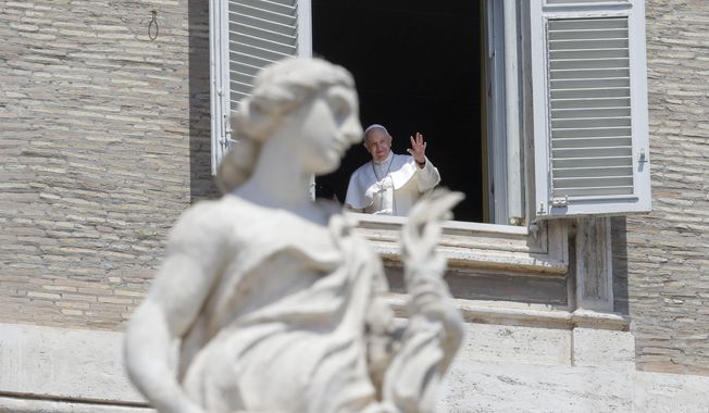 Pope Francis delivers his blessing from the window of his studio overlooking St. Peter&#x27;s Square, at the Vatican, Sunday, May 24, 2020. For the first time in months, well-spaced faithful gathered in St. Peter’s Square for the traditional Sunday papal blessing, casting their gaze at the window where the pope normally addresses the faithful, since the square had been closed due to anti-coronavirus lockdown measures. (AP Photo/Andrew Medichini)