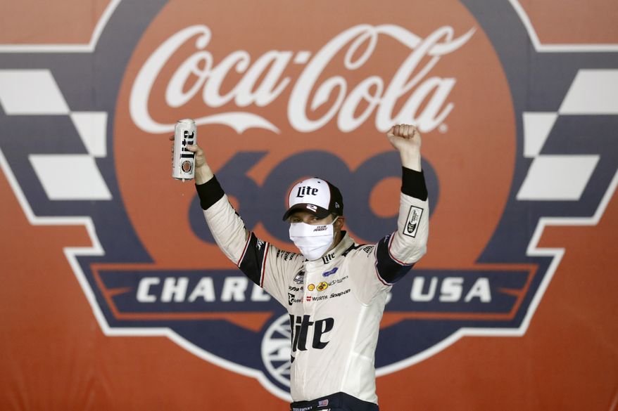 Brad Keselowski celebrates after winning the NASCAR Cup Series auto race at Charlotte Motor Speedway early Monday, May 25, 2020, in Concord, N.C. (AP Photo/Gerry Broome)