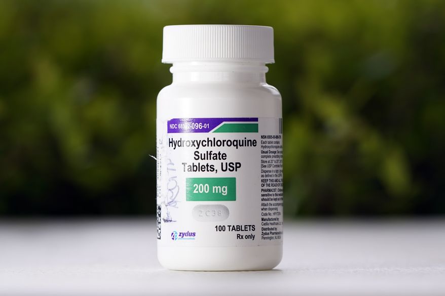FILE - This Tuesday, April 7, 2020 file photo shows a bottle of hydroxychloroquine tablets in Texas City, Texas. The World Health Organization said Monday May 25, 2020, that it will temporarily drop hydroxychloroquine from its global study into experimental COVID-19 treatments because its experts need to review all available evidence. (AP Photo/David J. Phillip, File)