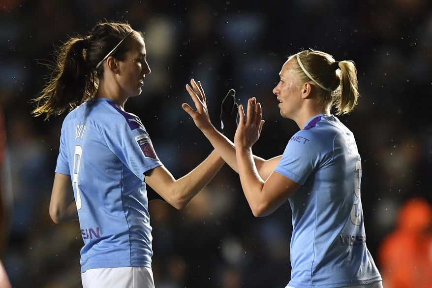 Manchester City's Pauline Bremer, right, celebrates scoring against Everton during the Women's Super League match at the Academy Stadium, Manchester, England, Saturday Jan. 11, 2020. (Anthony Devlin/PA via AP)