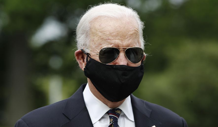 Democratic presidential candidate, former Vice President Joe Biden, with Jill Biden, departs after laying a wreath at the Delaware Memorial Bridge Veterans Memorial Park, Monday, May 25, 2020, in New Castle, Del. (AP Photo/Patrick Semansky)