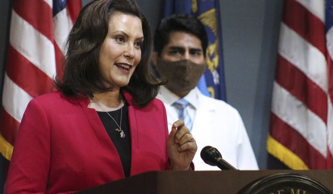 FILE - In this Thursday, May 21, 2020 file photo provided by the Michigan Office of the Governor, Michigan Gov. Gretchen Whitmer speaks during a news conference in Lansing, Mich. The owner of a boat service company said the husband of Michigan&#x27;s governor dropped her name while pleading to get his boat in the water for Memorial Day weekend. (Michigan Office of the Governor via AP, Pool, File)