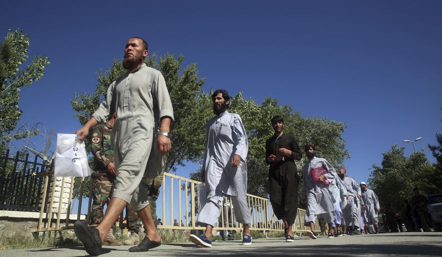 Afghan Taliban prisoners are released from Bagram Prison in Parwan province, Afghanistan, Tuesday, May 26, 2020.The Afghan government freed hundreds of prisoners, its single largest prisoner release since the U.S. and the Taliban signed a peace deal earlier this year that spells out an exchange of detainees between the warring sides. (AP Photo/ Rahmat Gul)