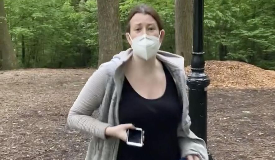 This image made from Monday, May 25, 2020, video provided by Christian Cooper shows Amy Cooper with her dog talking to Christian Cooper at Central Park in New York. A video of a verbal dispute between Amy Cooper, walking her dog off a leash and Christian Cooper, a black man bird watching in Central Park, is sparking accusations of racism. (Christian Cooper via AP) ** FILE **
