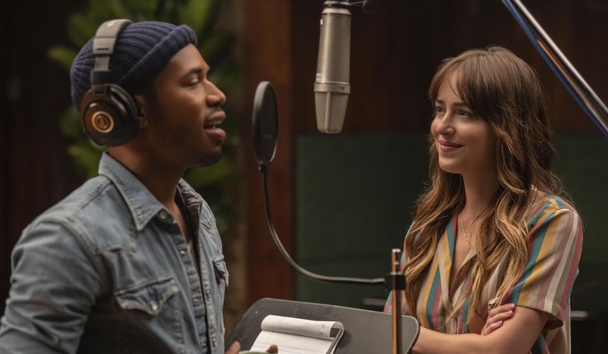This image released by Focus Features shows Kelvin Harrison Jr., left, and Dakota Johnson in a scene from "The High Note." (Glen Wilson/Focus Features via AP)