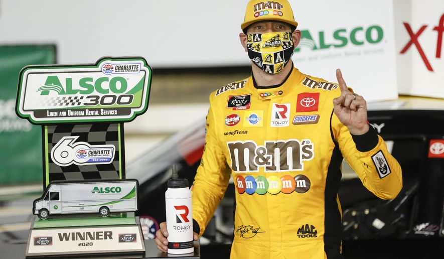 Kyle Busch celebrates after winning the NASCAR Xfinity Series auto race at Charlotte Motor Speedway Monday, May 25, 2020, in Concord, N.C. (AP Photo/Gerry Broome)