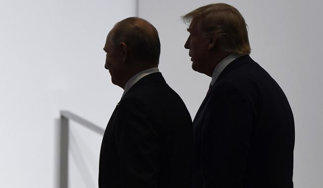 In this June 28, 2019, photo, President Donald Trump and Russian President Vladimir Putin walk to participate in a group photo at the G-20 summit in Osaka, Japan. (AP Photo/Susan Walsh/File)