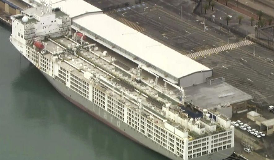 This image from a video shows a freight ship in Fremantle, Australia Tuesday, May 26, 2020. A coronavirus cluster was detected on Tuesday on the ship berthed in the Australian west coast port of Fremantle, raising questions about why local authorities weren’t alerted to the danger. (AuBC/CHANNEL 7/CHANNEL 9 via AP)