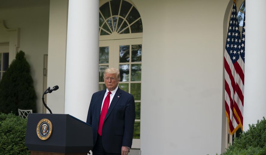 President Donald Trump listens as Vice President Mike Pence speaks during an event on protecting seniors with diabetes in the Rose Garden White House, Tuesday, May 26, 2020, in Washington. (AP Photo/Evan Vucci)