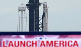 The SpaceX Falcon 9, with the Crew Dragon spacecraft on top of the rocket, sits on Launch Pad 39-A, Tuesday, May 26, 2020, at Kennedy Space Center in Cape Canaveral, Fla. Two astronauts will fly on the SpaceX Demo-2 mission to the International Space Station scheduled for launch on May 27. (AP Photo/David J. Phillip)