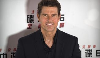 FILE - In this Aug. 29, 2018 file photo, Tom Cruise poses for photos during a red carpet event for the movie &amp;quot;Mission: Impossible - Fallout&amp;quot; at the Imperial Ancestral Temple in Beijing, China. Before the Wednesday, May 27, 2020 planned launch of two NASA astronauts aboard a SpaceX rocket, NASA administrator Jim Bridenstine, said, “I will tell you this: NASA has been in talks with Tom Cruise and, of course, his team, and we will do everything we can to make it a successful mission, including opening up the International Space Station,&amp;quot; he told The Associated Press. (AP Photo/Mark Schiefelbein)