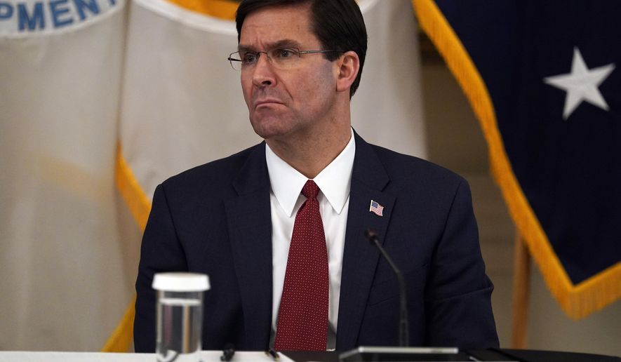 Defense Secretary Mark Esper listens during a Cabinet Meeting with President Donald Trump in the East Room of the White House, Tuesday, May 19, 2020, in Washington. (AP Photo/Evan Vucci)