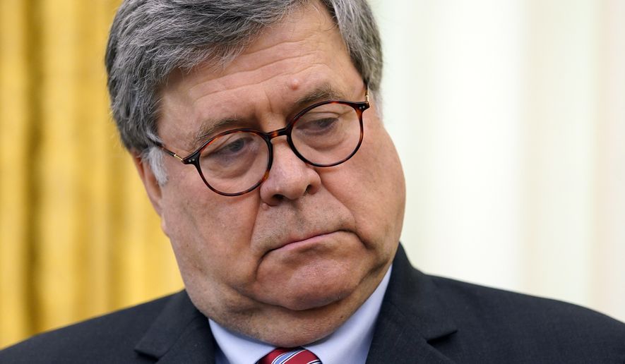 Attorney General William Barr listens as President Donald Trump speaks before signing an executive order aimed at curbing protections for social media giants, in the Oval Office of the White House, Thursday, May 28, 2020, in Washington. (AP Photo/Evan Vucci)