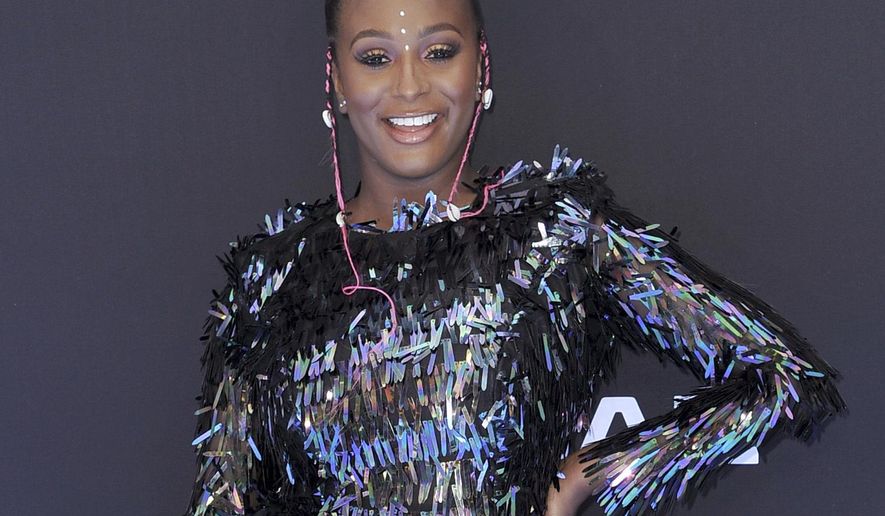 FILE - This June 23, 2019 file photo shows DJ Cuppy at the BET Awards in Los Angeles. Apple Music announced Thursday that “Africa Now Radio” will debut Sunday and will feature a mix of contemporary and traditional popular African sounds, including genres like Afrobeat, rap, house, kuduro and more. Cuppy, the Nigerian-born DJ, will host the weekly one-hour show, which will be available at 9 a.m. EDT. (Photo by Richard Shotwell/Invision/AP, File)