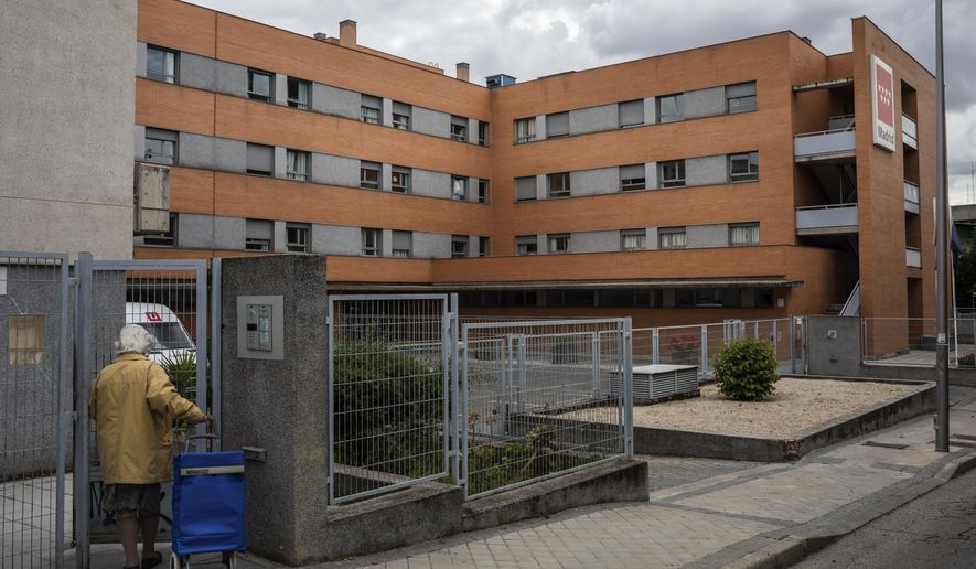 In this Wednesday, May 13, 2020 photo, view of the Usera Center for the Elderly in Madrid, Spain. Workers at the Usera nursing home have spoken about cost cutting and staff cuts at the Madrid nursing home where 42 people died.(AP Photo/Bernat Armangue)