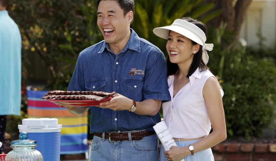 In this image released by ABC, Randall Park, left, and Constance Wu appear in a scene from the new comedy series &amp;quot;Fresh Off the Boat.&amp;quot; The all-Asian casts of “Fresh Off the Boat” and Canadian sitcom “Kim’s Convenience” are partnering for one night for charity. In honor of Asian Pacific American Heritage Month, the stars of both TV comedies will do live online table reads of their respective pilot episodes on Saturday, according to Deadline. (Nicole Wilder/ABC via AP)