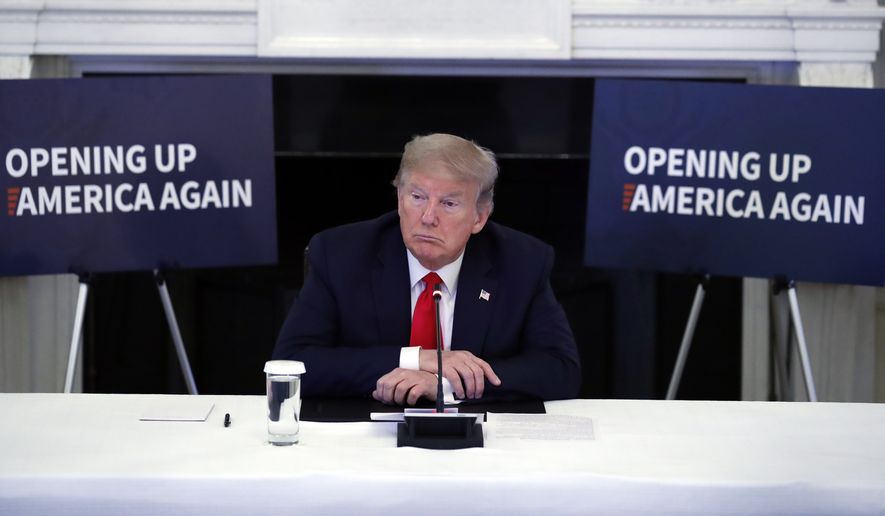 President Donald Trump listens during a roundtable with industry executives about reopening country after the coronavirus closures, in the State Dining Room of the White House, Friday, May 29, 2020, in Washington. (AP Photo/Alex Brandon)