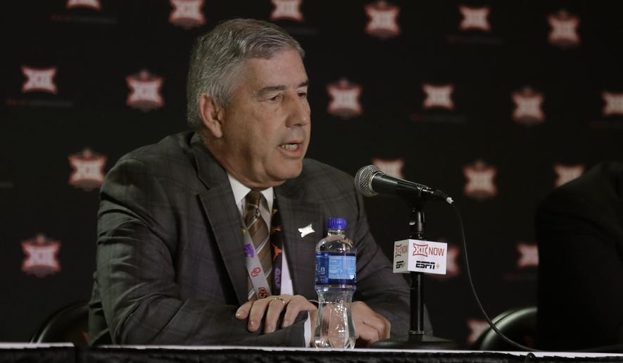Big 12 commissioner Bob Bowlsby talks to the media after canceling the remaining NCAA college basketball games in the Big 12 Conference tournament due to concerns about the coronavirus Thursday, March 12, 2020, in Kansas City, Mo. The biggest conferences in college sports all canceled their basketball tournaments because of the new coronavirus, seemingly putting the NCAA Tournament in doubt. (AP Photo/Charlie Riedel)