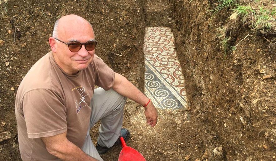 Gianni De Zuccato a well-preserved colorful mosaic floor of an ancient Roman villa archaeologists have revealed among vineyards near the northern city of Verona, Italy. The official in charge of archaeology Verona province, Gianni De Zuccato, on Friday, May 29,2020, said the mosaics appeared to be ‘’in a good state of conservation,’’ from what they are able to observe after gingerly digging a trench between vineyards in the hills of Valpolicella, known for its full-bodied red wine. (Soprintendenza ABAP Verona via AP)