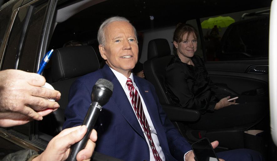 FILE - In this April 26, 2019 file photo, former Vice President and Democratic presidential candidate Joe Biden rides in a car after appearing on ABC's "The View" in New York. On Friday, May 29, 2020, The Associated Press reported on a video circulating online appearing to show the presumptive Democratic presidential candidate on “The View” avoiding a question about inappropriate touching. The video, taken from Biden’s April 26, 2019, appearance on the daytime talk show was edited to make it appear he failed to give a direct answer to the question about inappropriate touching and stumbled through the response. (AP Photo/Eduardo Munoz Alvarez)