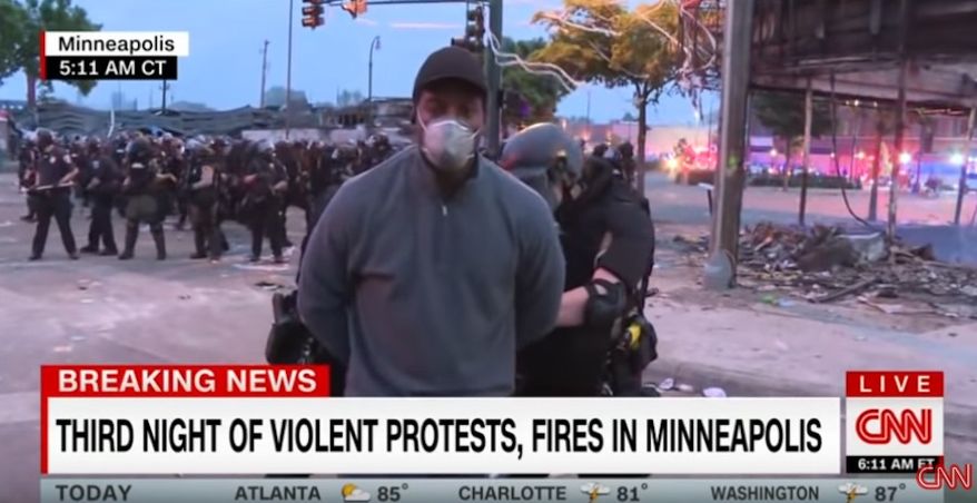 Minnesota Gov. Tim Walz apologized Friday, May 29, 2020, to CNN president Jeff Zucker after several CNN crew members, including reporter Omar Jimenez, were arrested during a live broadcast in Minneapolis. (screen grab via CNN)