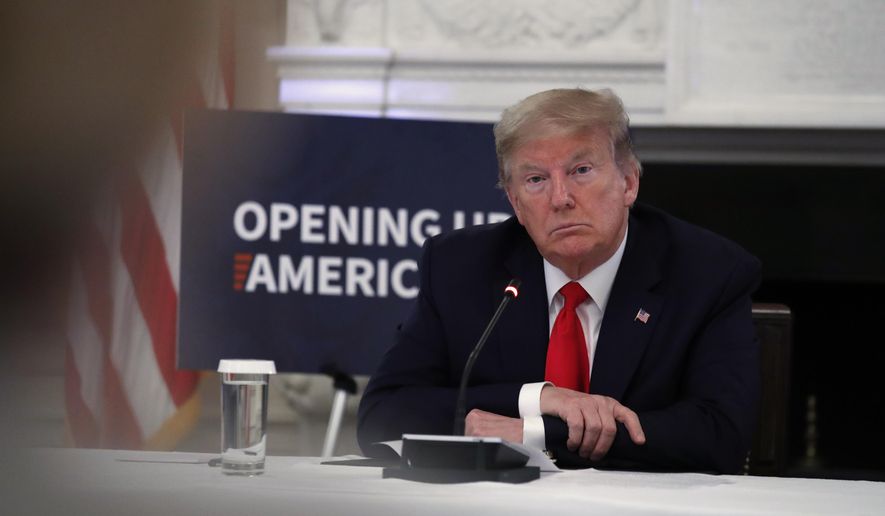 President Donald Trump listens as Dr. Deborah Birx, White House coronavirus response coordinator, speaks during a roundtable with industry executives about reopening country after the coronavirus closures, in the State Dining Room of the White House, Friday, May 29, 2020, in Washington. (AP Photo/Alex Brandon)