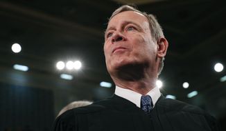 In this Tuesday, Feb. 4, 2020, file photo, Supreme Court Chief Justice John G. Roberts Jr. arrives before President Donald Trump delivers his State of the Union address to a joint session of Congress on Capitol Hill in Washington. (Leah Millis/Pool via AP, File)