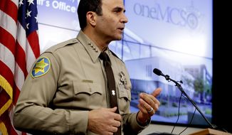 FILE - This Feb. 14, 2019, file photo shows Maricopa County Sheriff Paul Penzone at a news conference in Phoenix. A report on traffic enforcement by sheriff&#39;s deputies in metro Phoenix during 2019 has found that stops of Hispanic and black drivers were more likely to last longer and result in searches than those of white drivers. The Maricopa County Sheriff&#39;s Office was required to produce the study as one of the remedies to a 2013 ruling that concluded its officers had racially profiled Latinos in then-Sheriff Joe Arpaio&#39;s immigration patrols. (AP Photo/Matt York, File)