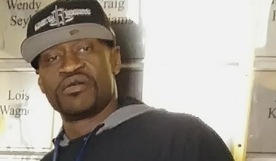 This undated handout photo provided by Christopher Harris shows George Floyd. The mayor of Minneapolis called Wednesday, May 27, 2020, for criminal charges to be filed against officer Derek Chauvin, who is seen on video kneeling against the neck of handcuffed Floyd, who complained that he could not breathe and died in police custody. (Christopher Harris via AP)