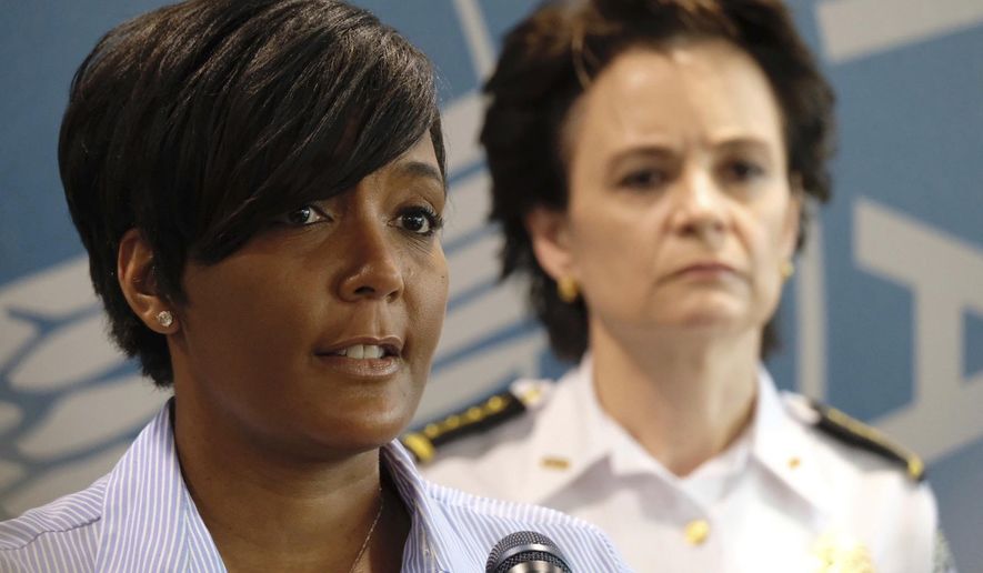Atlanta Mayor Keisha Lance Bottoms announces a 9 p.m. curfew as protests continue over the death of George Floyd, Saturday, May 30, 2020, in Atlanta. Protests were held in U.S. cities over the death of Floyd, a black man who died after being restrained by Minneapolis police officers on May 25. (Ben Gray/Atlanta Journal-Constitution via AP)