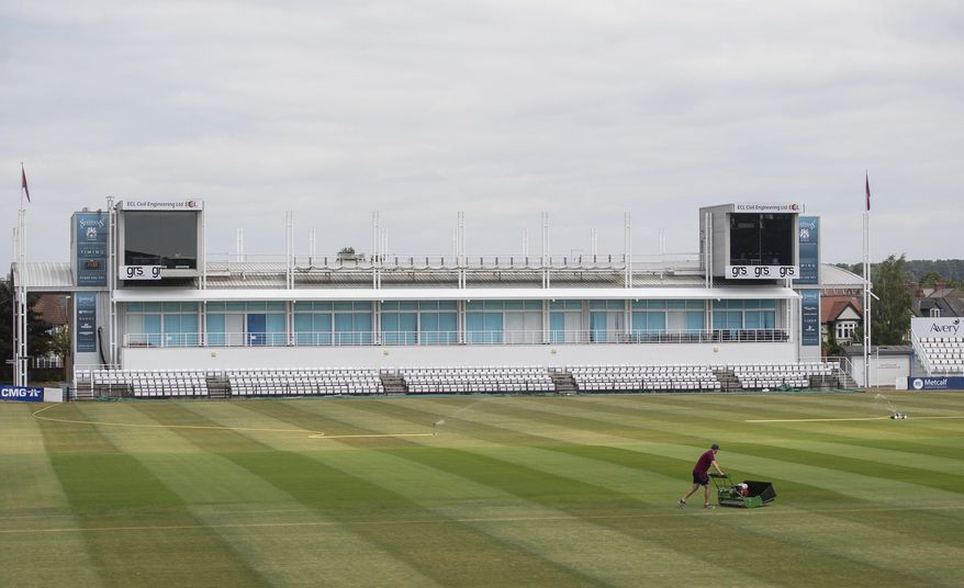 Head groundsman Craig Harvey tends to the outfield at the County Ground, home of Northamptonshire County Cricket Club, in Northampton, England, Wednesday May 27, 2020. Professional cricket teams are waiting to be given the green light to return to competitive sport following the highly contagious coronavirus pandemic. (Joe Giddens / PA via AP)
