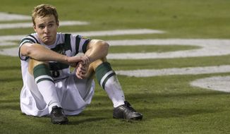 FILE - In this Dec. 11, 2011, file photo, UNC Charlotte midfielder Aidan Kirkbride reacts at the end of a 1-0 loss to North Carolina in the NCAA College Cup soccer championship in Hoover, Ala. Four-year colleges facing budget shortfalls stemming from the coronavirus outbreak have eliminated a total of nearly 100 sports programs since March. (AP Photo/Dave Martin, File)