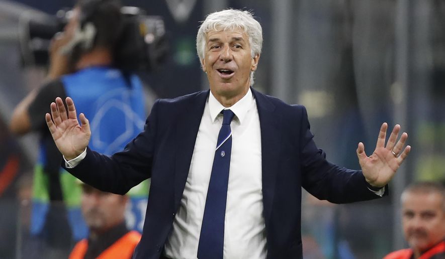 FILE - In this  Tuesday, Oct. 1, 2019 file photo, Atalanta coach Gian Piero Gasperini gives instructions during the Champions League group C soccer match between Atalanta and Shakhtar Donetsk at the San Siro stadium in Milan, Italy. Gasperini says he had the coronavirus and was concerned for his life mid-March. Gasperini tells the Gazzetta dello Sport that he started feeling sick on March 9, a day before Atalanta played at Valencia in the second leg of the Champions League round of 16. (AP Photo/Antonio Calanni, File)