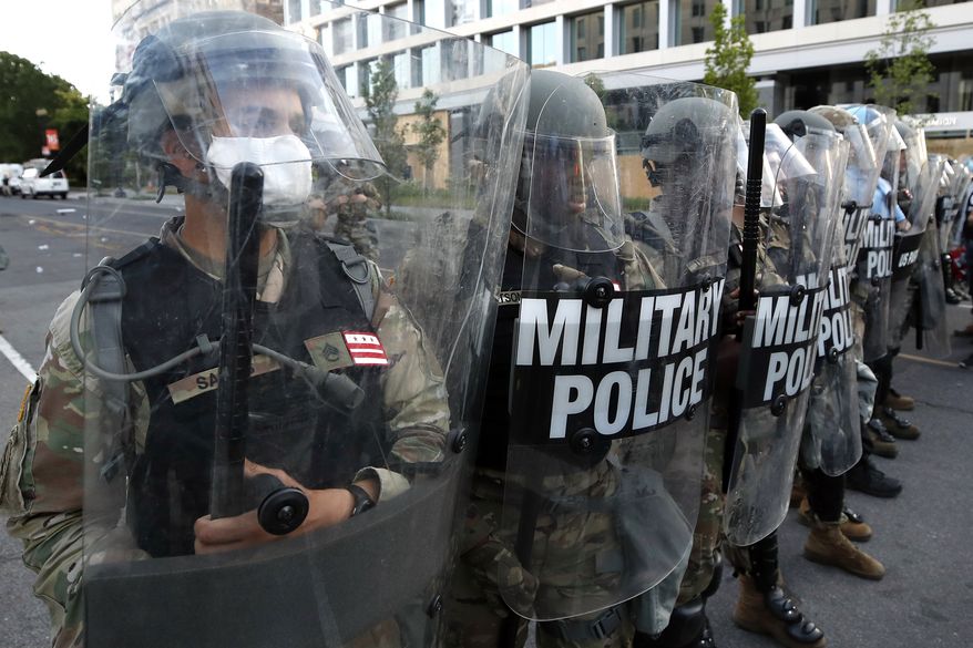 Police clear the area around Lafayette Park and the White House as demonstrators gather to protest the death of George Floyd, Monday, June 1, 2020, in Washington. Floyd died after being restrained by Minneapolis police officers. (AP Photo/Alex Brandon)