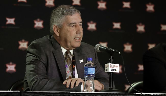 FILE - In this March 12, 2020, file photo, Big 12 commissioner Bob Bowlsby talks to the media after canceling the remaining NCAA college basketball games in the Big 12 Conference tournament due to concerns about the coronavirus in Kansas City, Mo. Big 12 schools still got a strong payout from the conference during the pandemic. The revenue distribution to the league&#x27;s 10 schools for the 2019-20 school year averages $37.7 million each. That figure announced Friday, May 29, 2020, at the end of the league&#x27;s virtual spring meetings was down only about $1.1 million a school from last year. (AP Photo/Charlie Riedel, File)